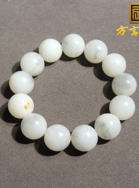 羊脂白玉挂金皮青花籽料