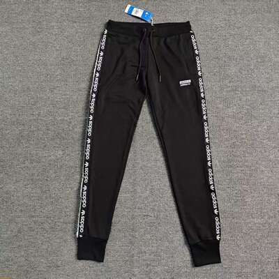 阿迪达斯三叶草女子针织涤纶透气舒适黑白串标logo缩口长裤FI7114