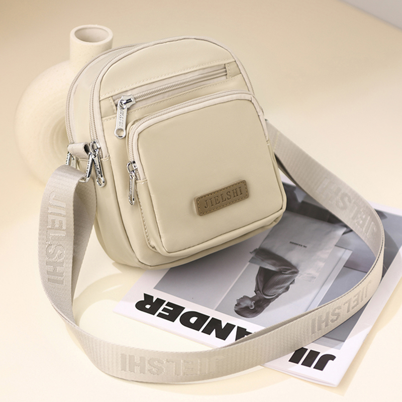 女士斜挎包2024新款春季简约牛津布小方包轻便尼龙帆布迷你小包包