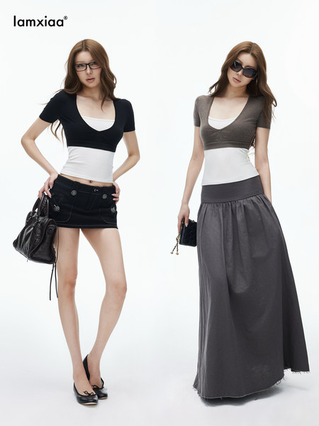 Two models wearing fitted tops with skirts and accessories on a white background