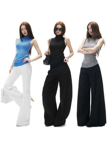 Three models wearing sleeveless turtleneck tops with wide-leg pants in different colors