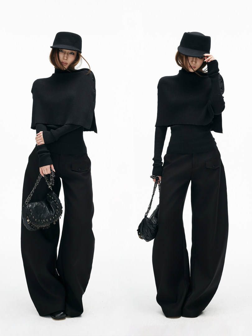 Black fashion outfit worn by a model with wide-leg pants, turtleneck top, and hat