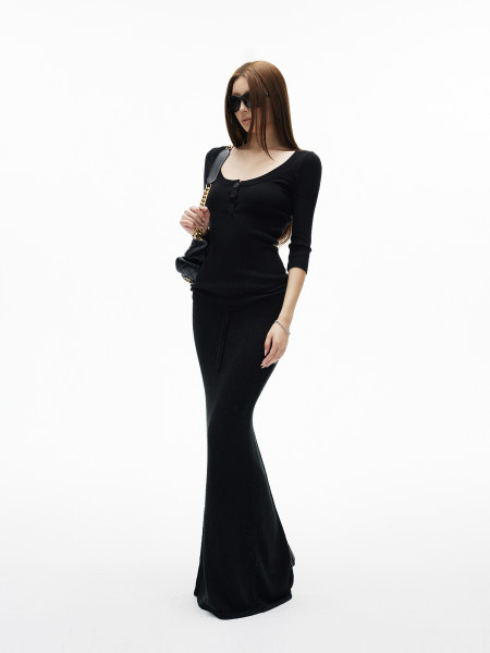 Black fitted long-sleeve maxi dress worn by a model
