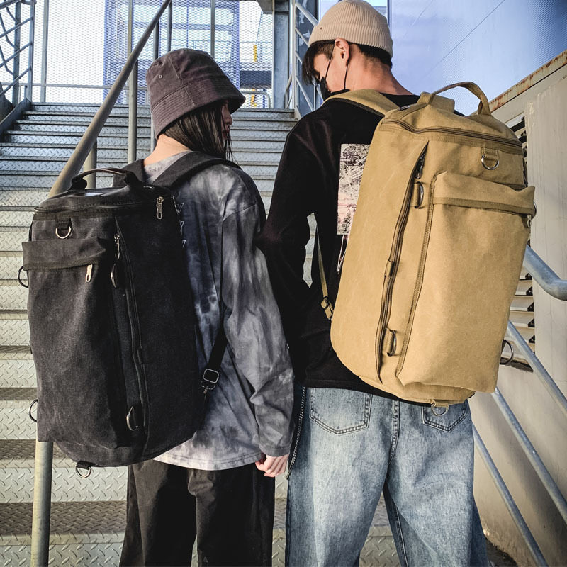 时尚男包大容量旅行双肩包男士户外旅游运动圆筒背包潮流帆布书包