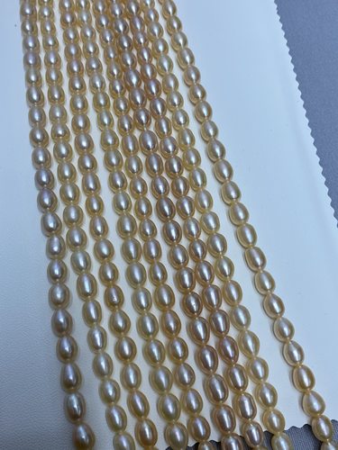 水之泪天然淡水珍珠项链行业6-7mm无核米形中国红强光微瑕桔色diy