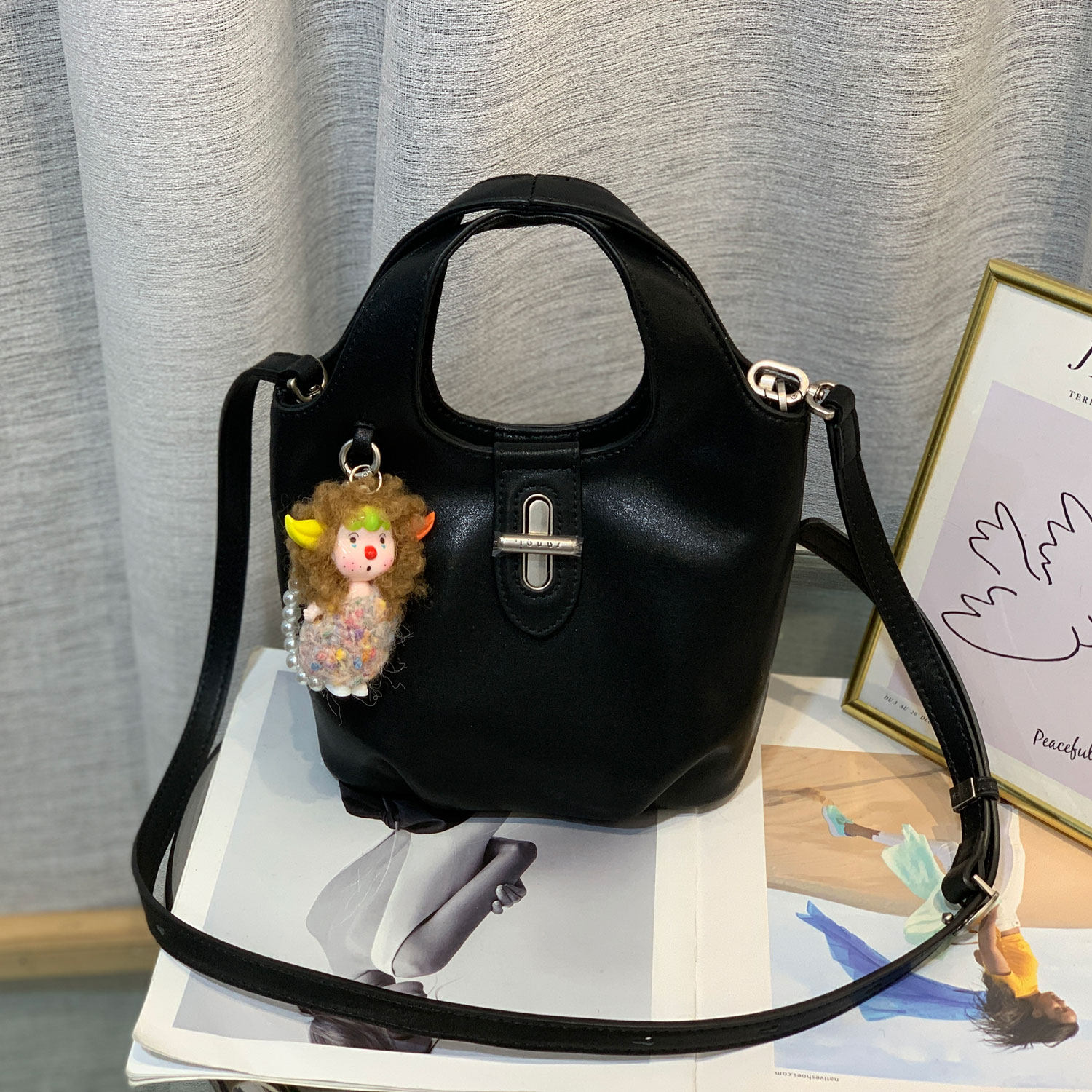 小众高级感锁扣牛皮糖果水桶包女2026春夏新款百搭手提单肩斜挎包