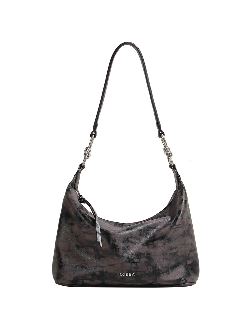 Black shoulder handbag on a white background