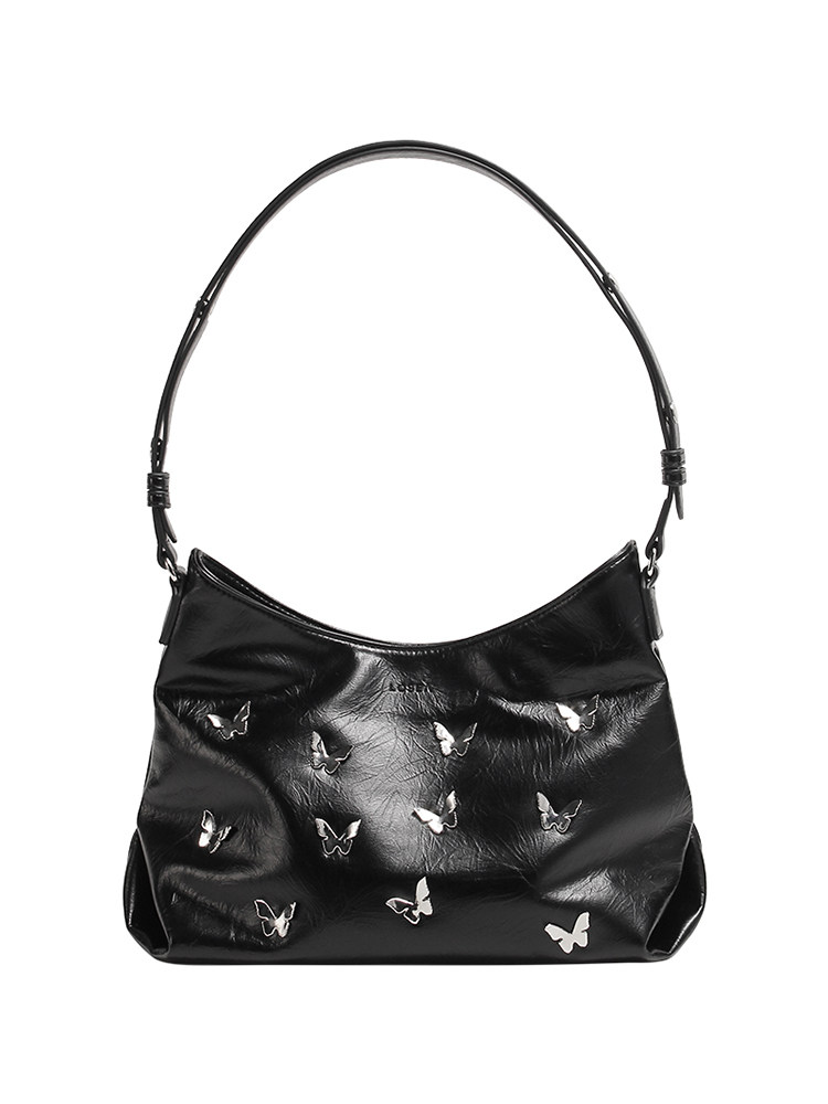 Black shoulder handbag with butterfly embellishments on a white background