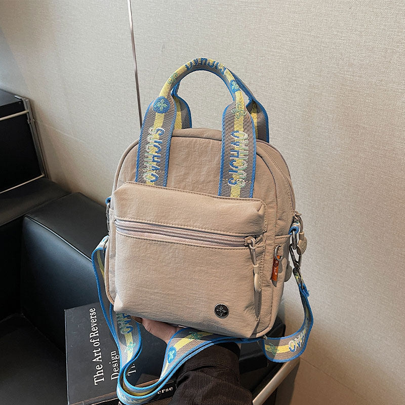 休闲手提包包女2025新款时尚简约帆布通勤包外出轻便百搭斜挎背包