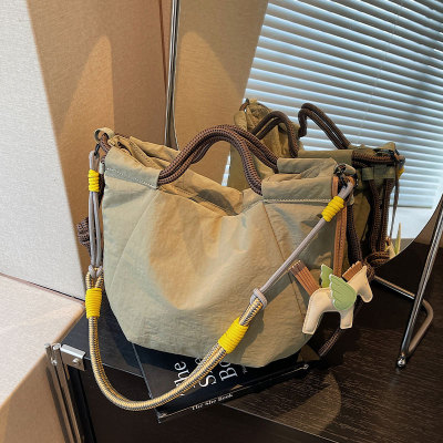 牛津布轻便手提通勤包斜挎饺子包