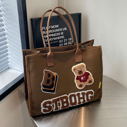 大容量单肩通勤包百搭手提妈咪包