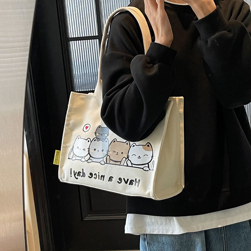 卡通猫咪帆布包包女2025新款休闲学生装书单肩包手拎便当包托特包