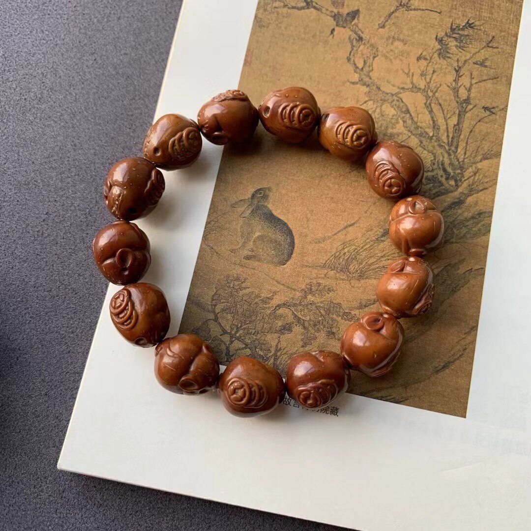 紫金鼠雕刻招财鼠手串!招财纳福!尺寸15-18mm左右颜色有紫有黄