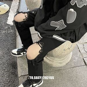 1506/Q80510/P32纯黑色破洞牛仔裤男高街潮牌修身直筒微喇裤图片