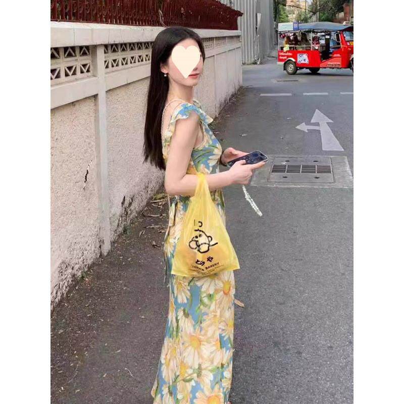 茶歇法式油画碎花吊带连衣裙子女夏季新款海边度假沙滩甜美中长裙