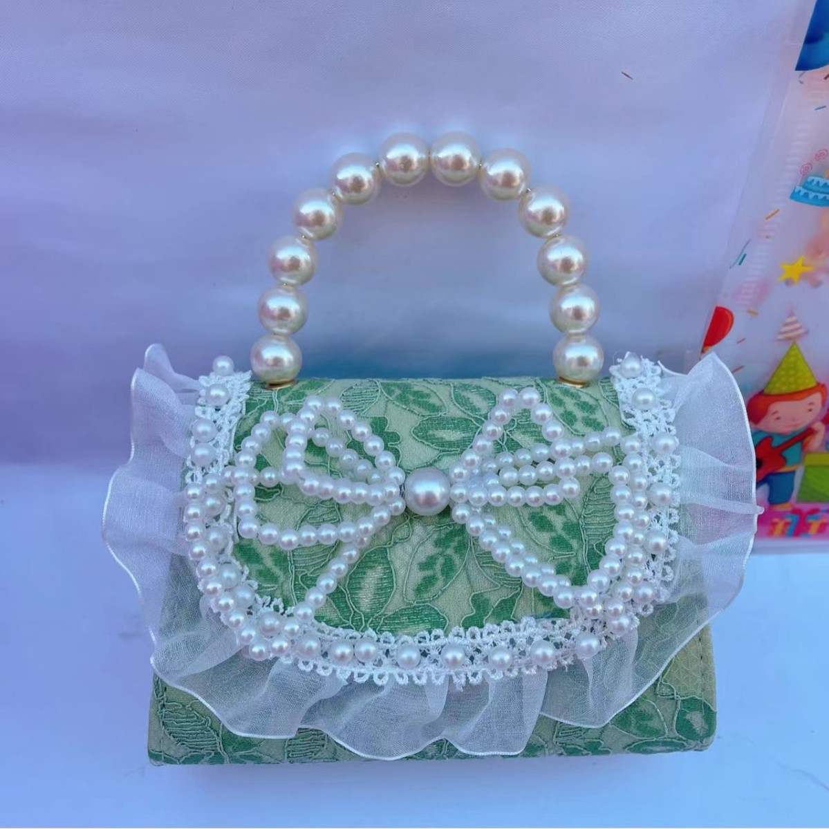 珍珠手提包韩版蝴蝶结小香风单肩包女孩公主幼儿园零钱装饰包包女