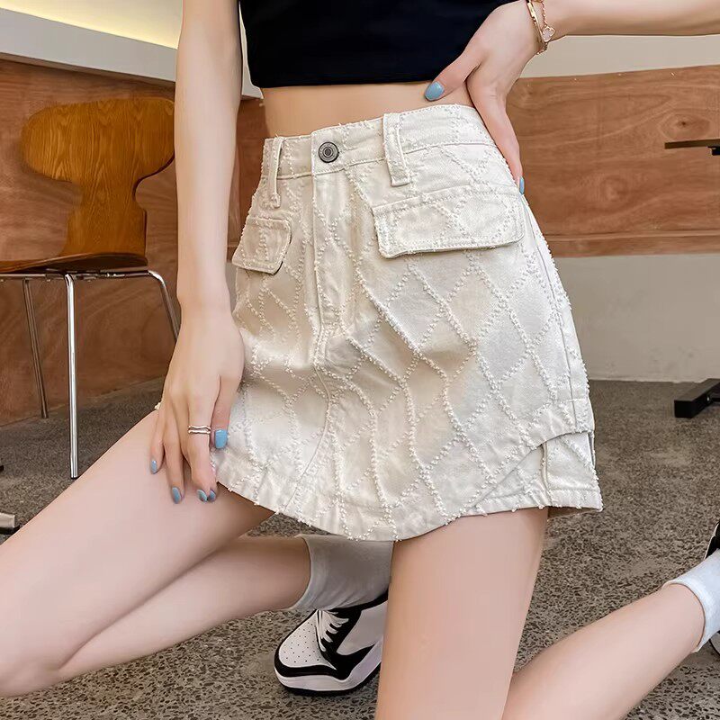 白色提花牛仔半身裙女夏季2026新款高腰设计感不规则裙裤a字短裙