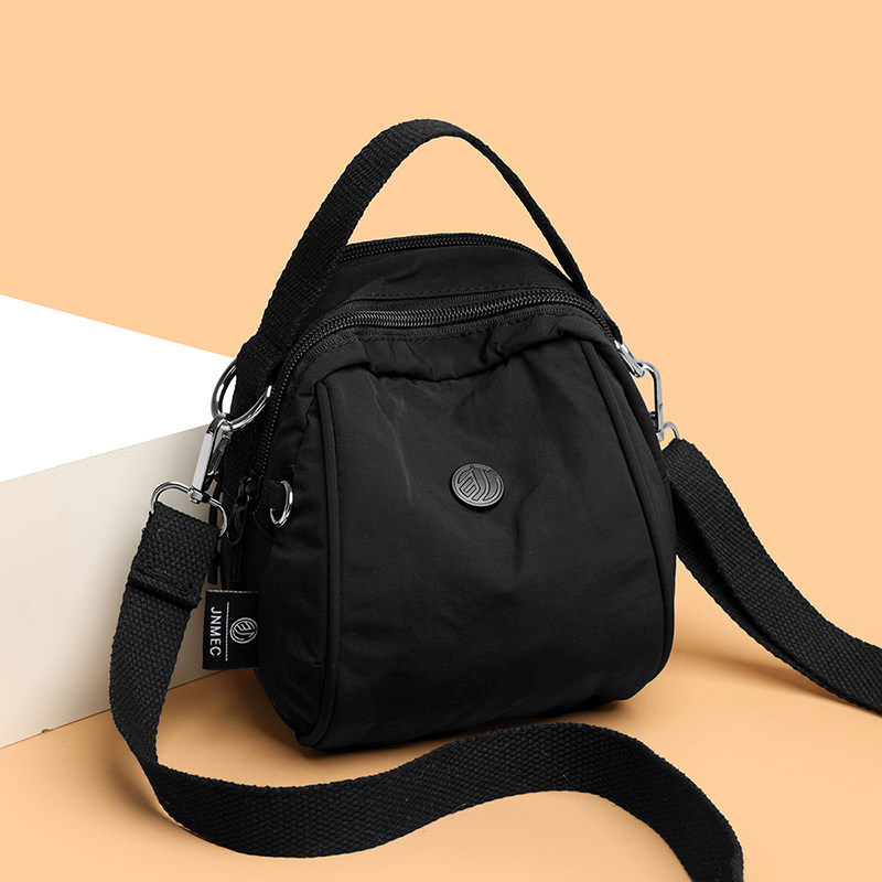 女士单肩休闲简约风斜挎包轻便手提包时尚百搭贝壳包中老年小背包