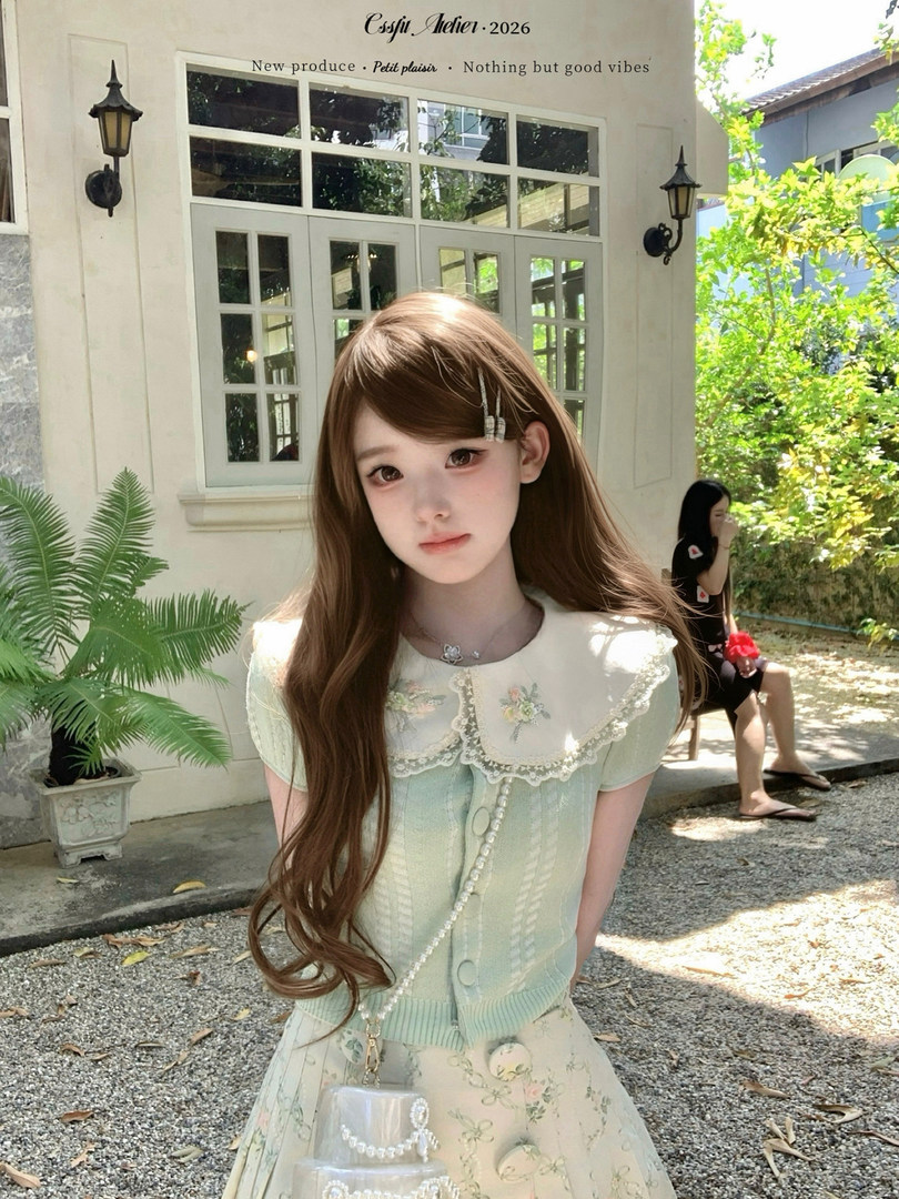 Model wearing a pastel mint lace-collar dress set outdoors