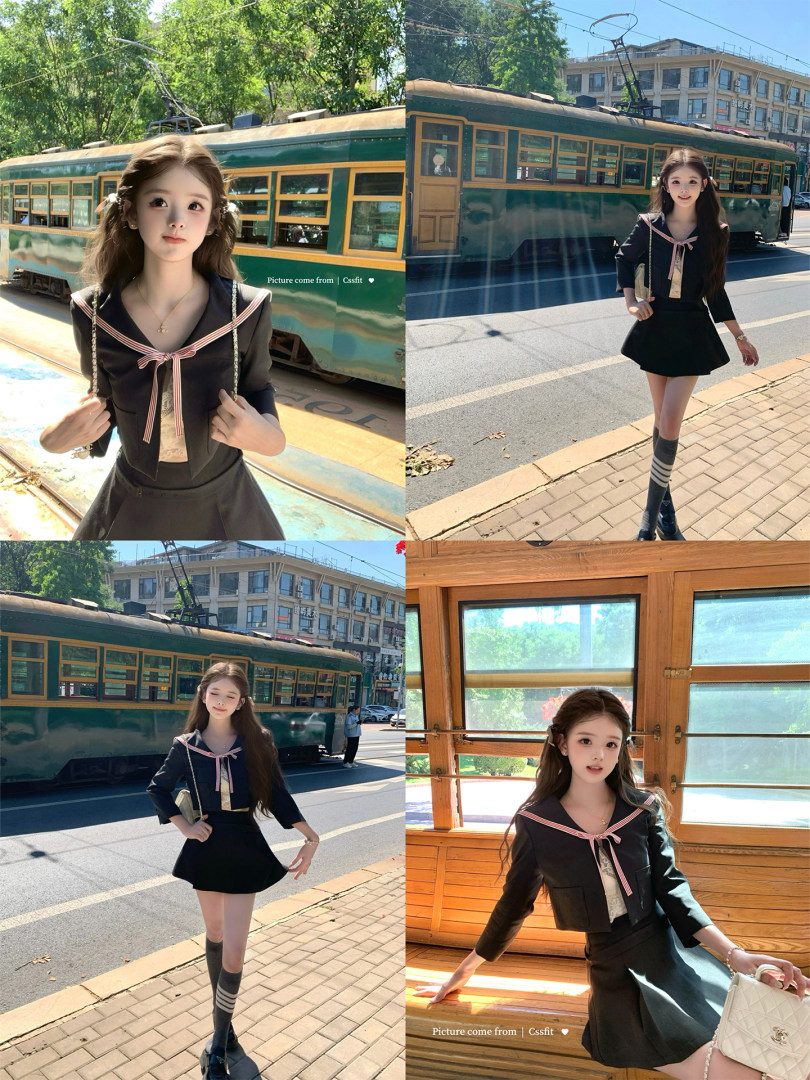 Black sailor-style top and skirt outfit worn by a model outdoors