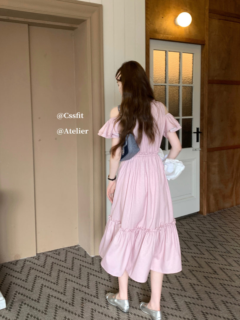 Woman wearing a pink off-shoulder midi dress