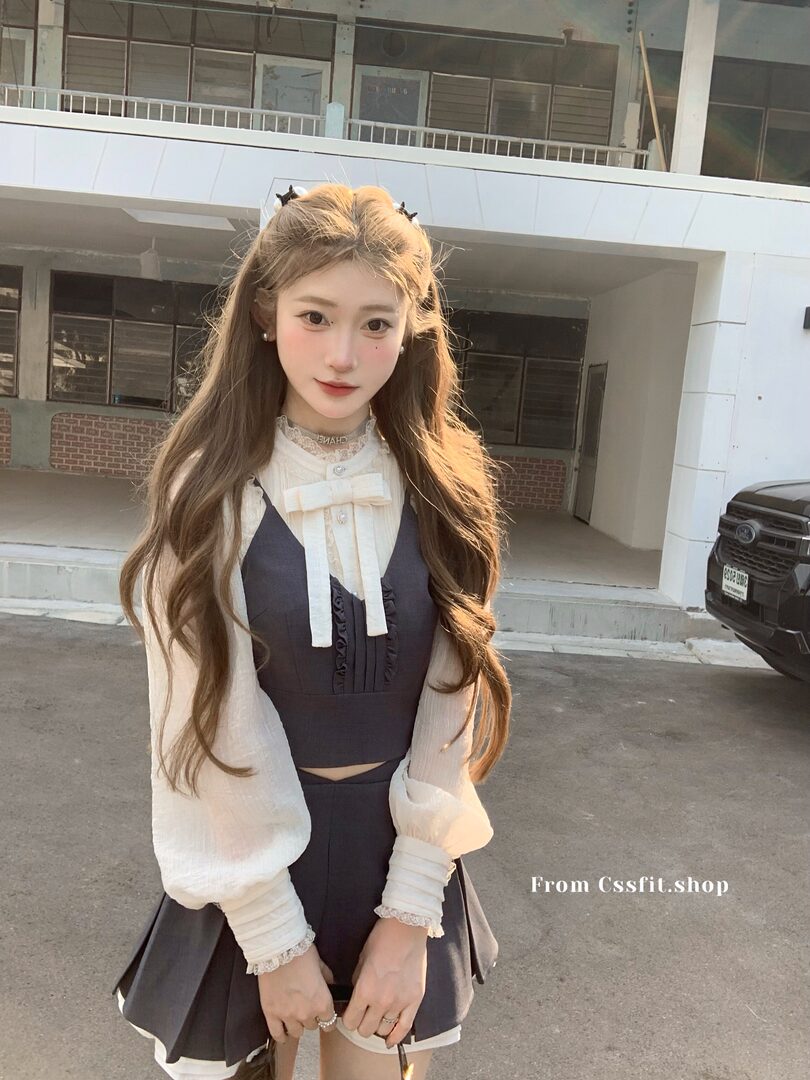 Young woman wearing a black-and-white preppy dress outfit outdoors