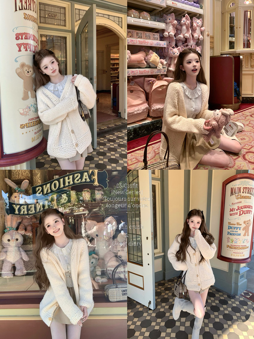 Model wearing a cream chunky knit cardigan with a ruffled blouse and short skirt in a store setting