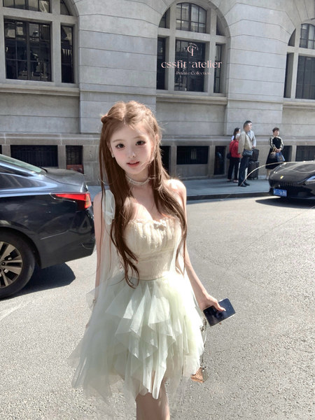 Woman wearing a light pastel tulle dress outdoors