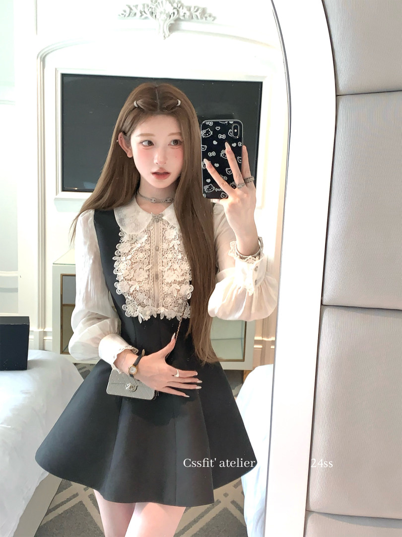 Black dress with white lace front and sheer sleeves worn in a mirror selfie