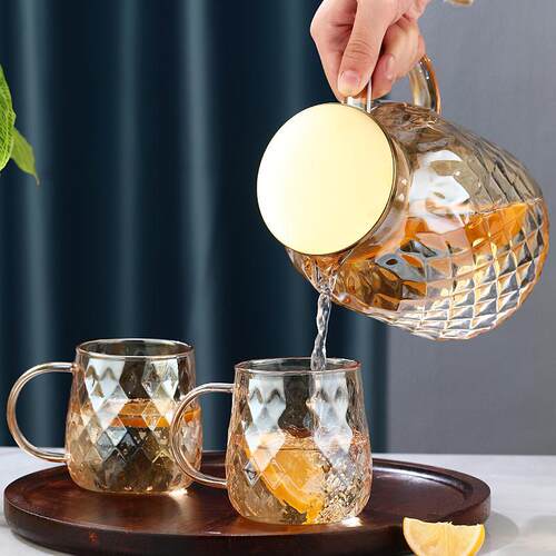Amber colored cool water kettle with diamond pattern, light