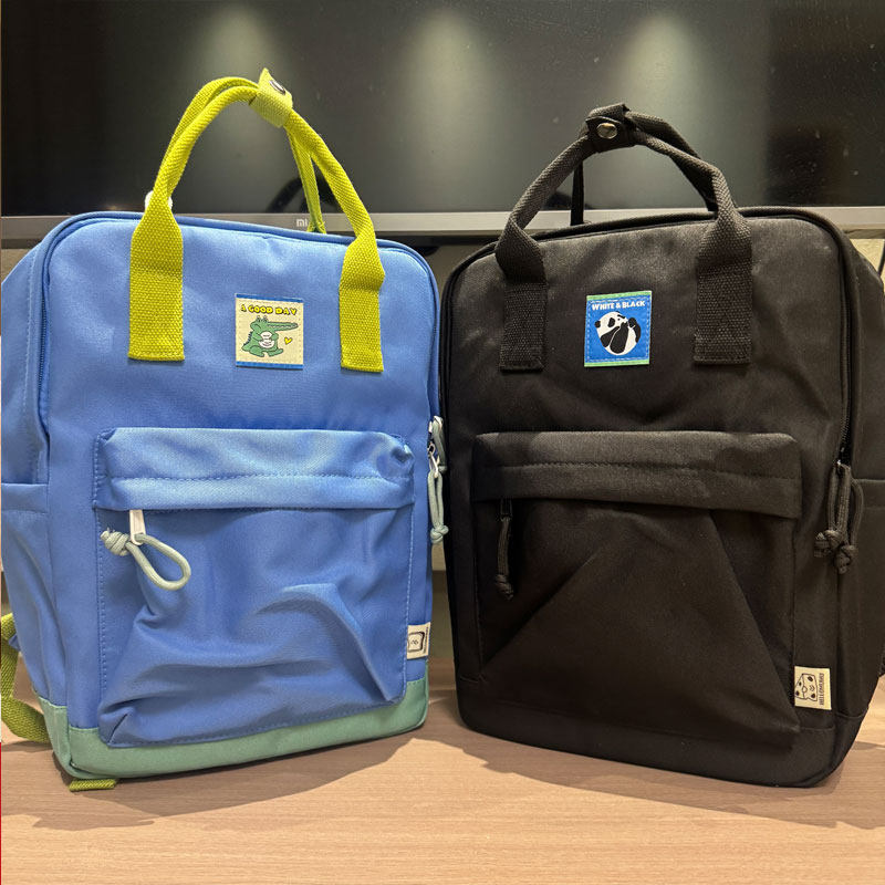 户外双肩包男女学生书包电脑包大容量轻便旅行背包蓝色撞色手提包