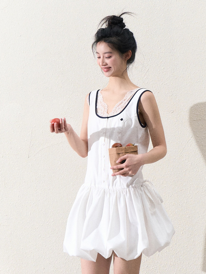 White sleeveless dress worn by a model