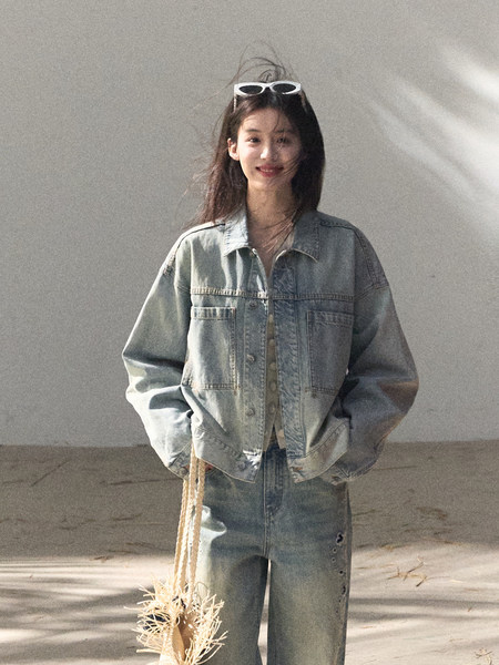 Model wearing a light blue denim jacket and matching jeans