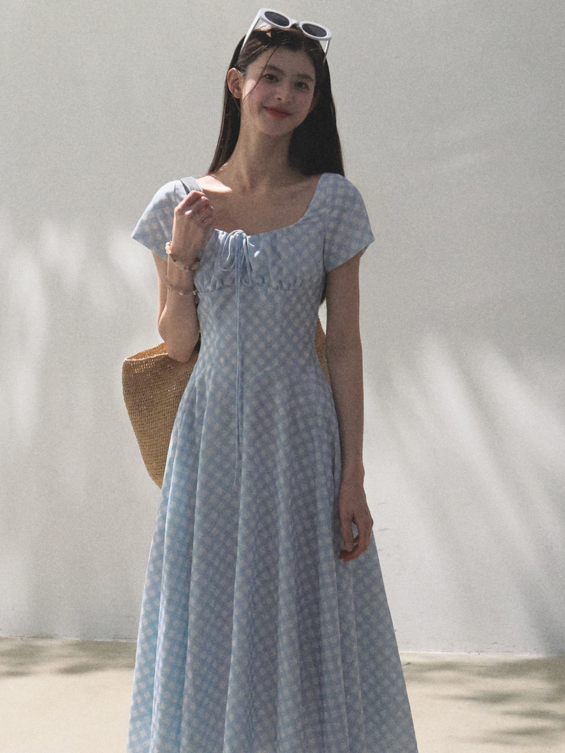 Model wearing a light blue floral short-sleeve dress