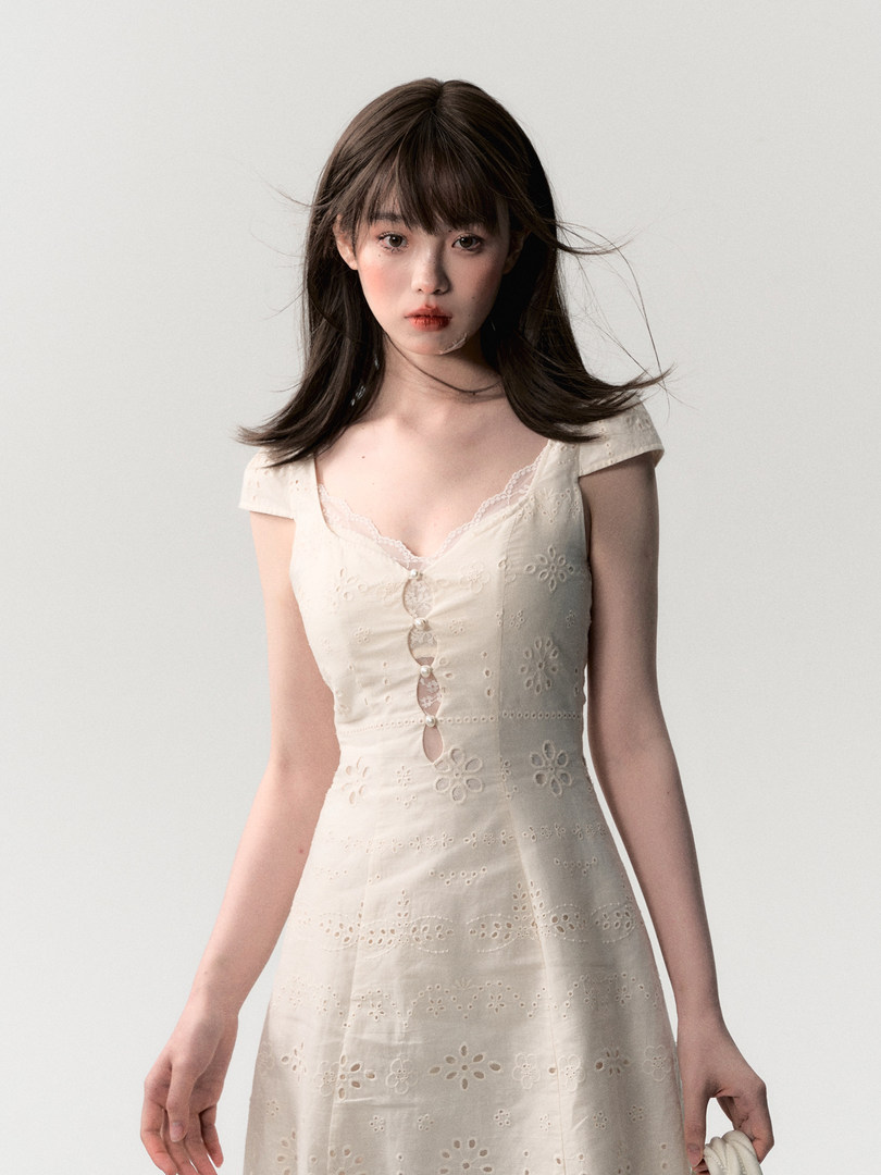 Cream embroidered dress worn by a model
