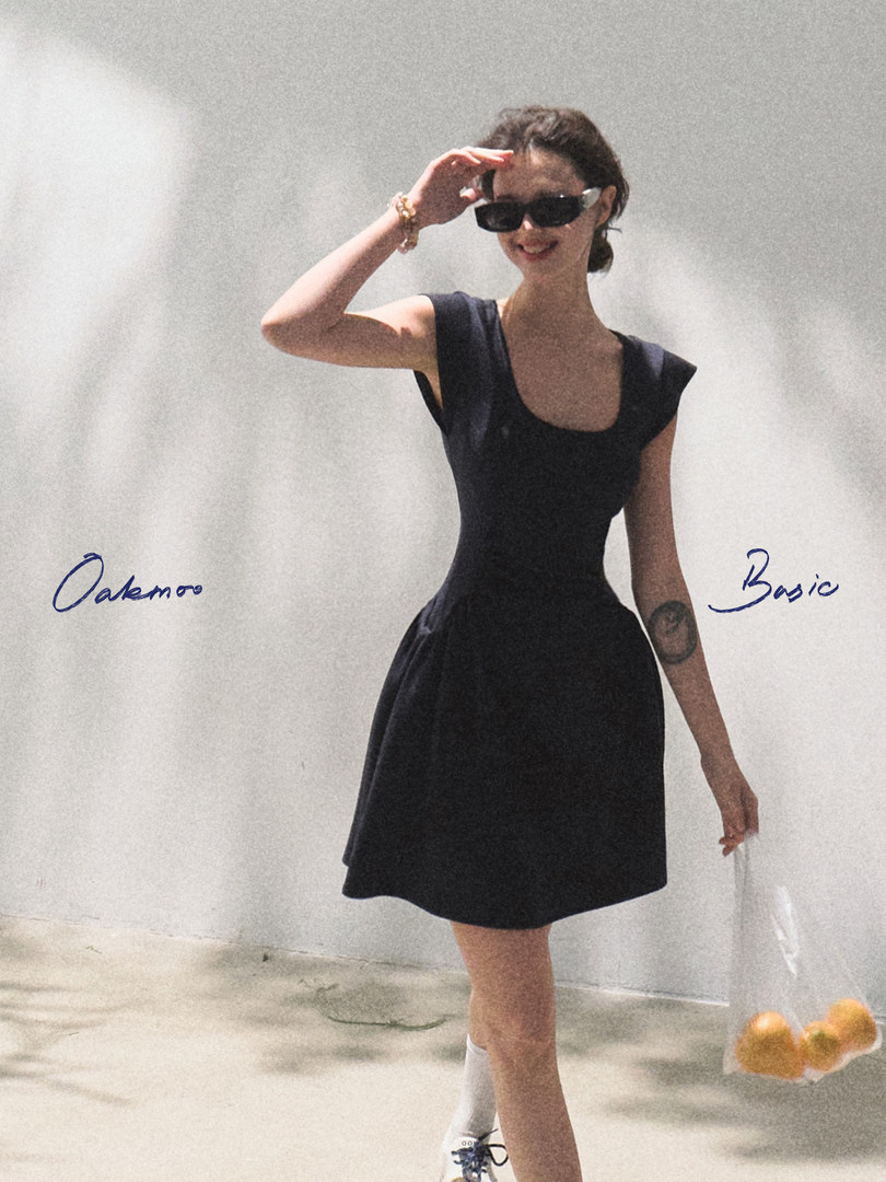 Black sleeveless dress worn by a model