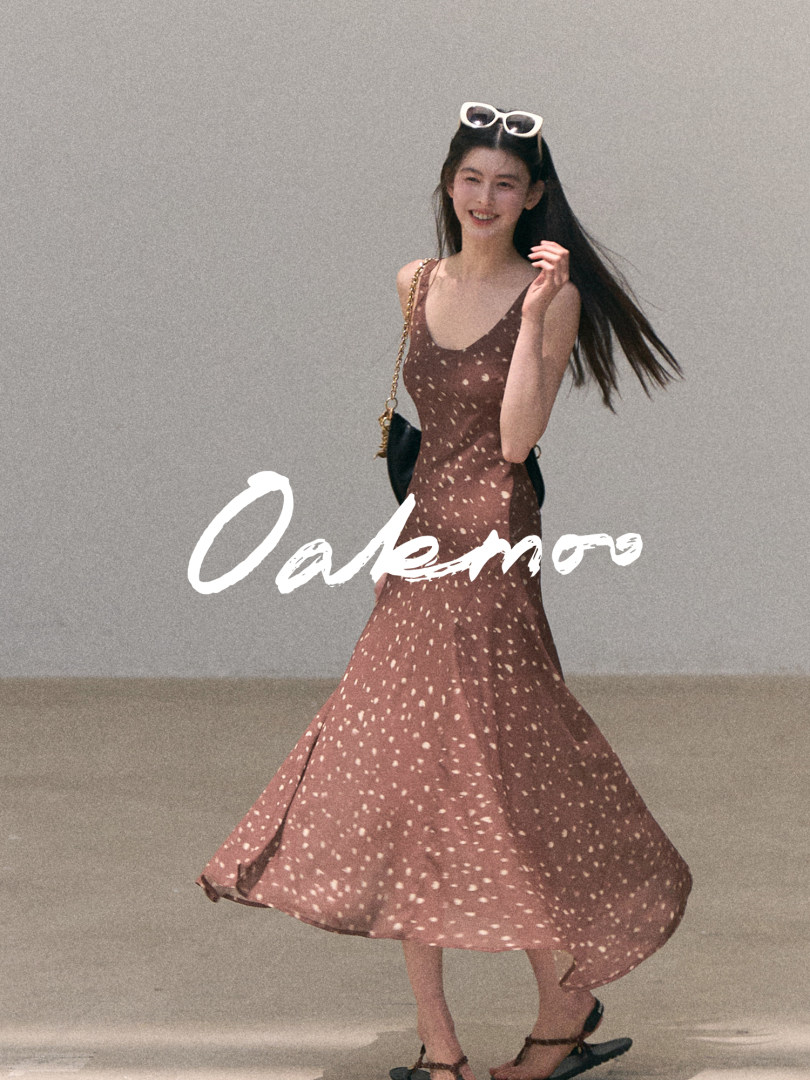 Model wearing a brown speckled sleeveless midi dress