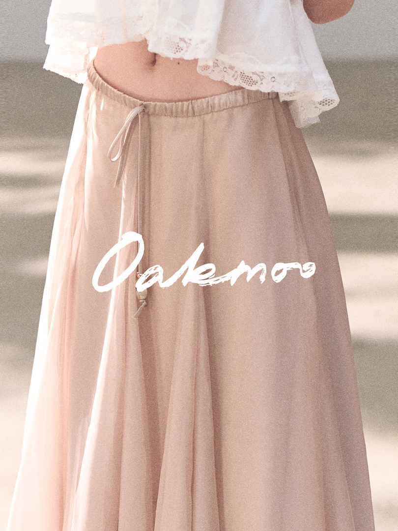 Light pink flowy maxi skirt worn by a model