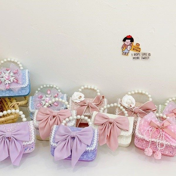 秋冬季韩版蝴蝶结山茶花儿童包珍珠手提蕾丝花边幼儿园女孩斜挎包