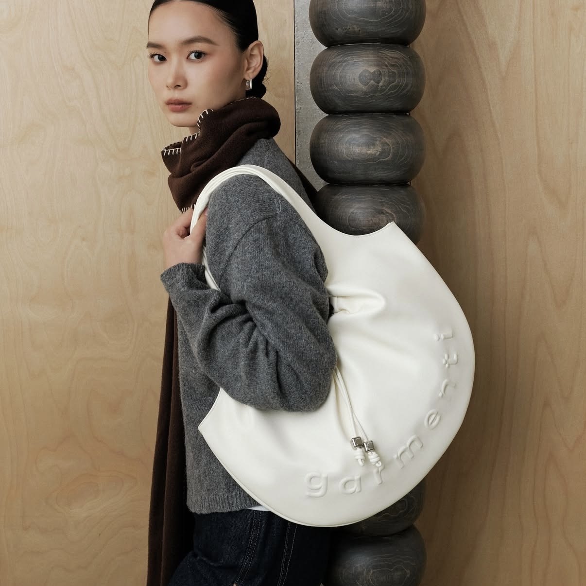 泰国潮牌 garmenti抽绳设计皮革饺子包