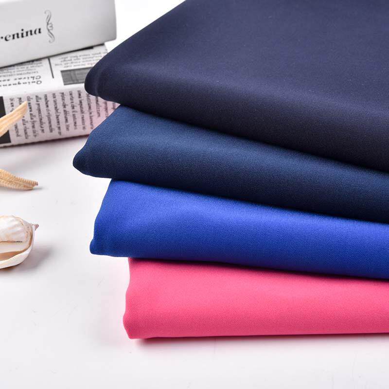 春夏全涤弹力加捻罗马布涤纶针织面料 休闲裤哈伦裤布料抗起爆款