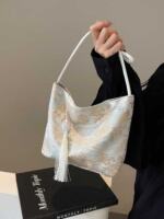 The 2024 new style of Chinese-style handbag for women features a high-end and niche design. It is a new Chinese-style handbag with retro tassels on one shoulder and under the armpit thumbnail 7