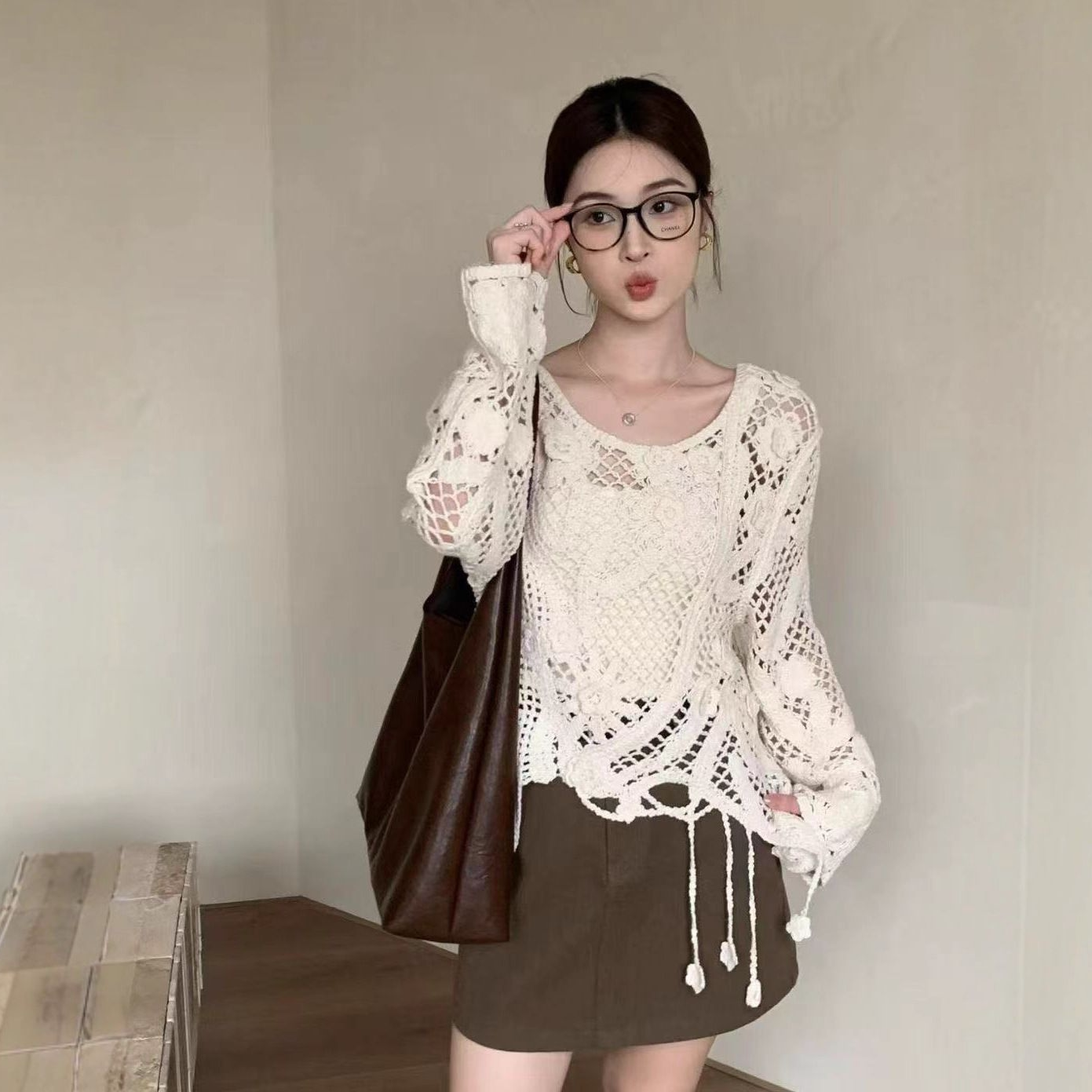 度假风镂空钩花编织长袖罩衫女春秋设计感小众花朵流苏针织衫上衣