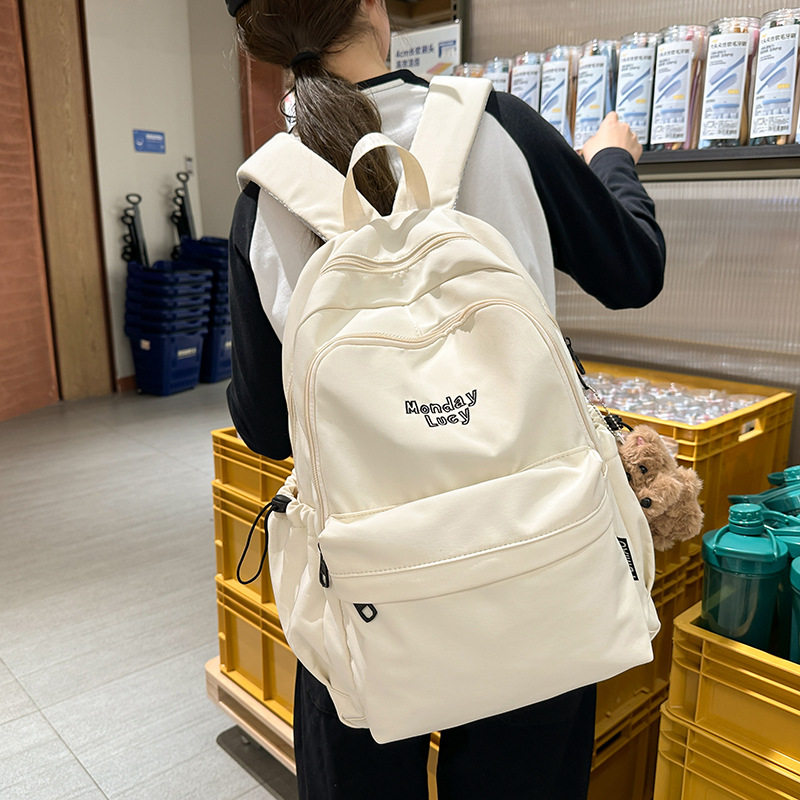 新款时尚休闲百搭双肩包女士潮流纯色背包轻便多用途简约学生书包
