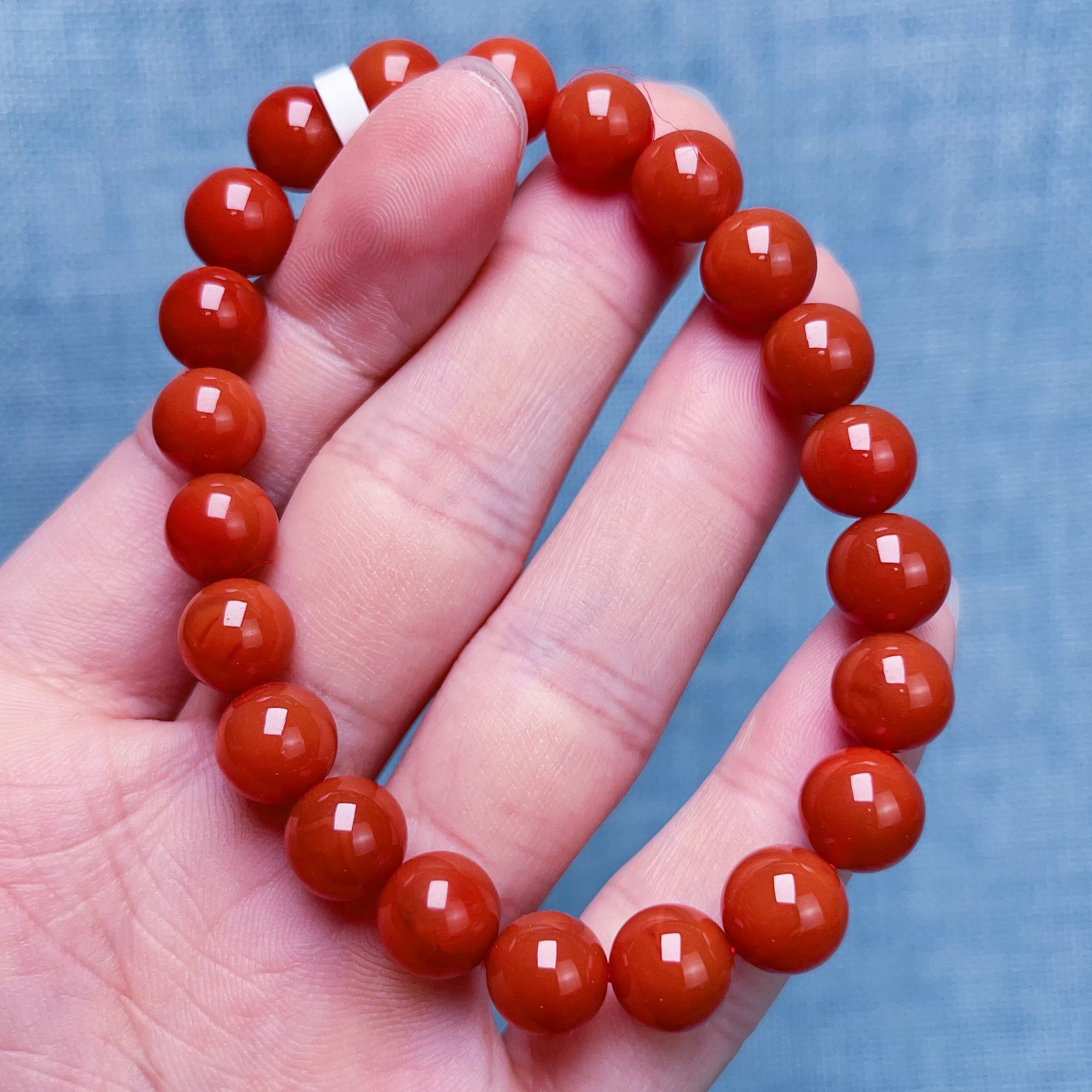 1409D05凉山瓦西料柿子红单圈手串