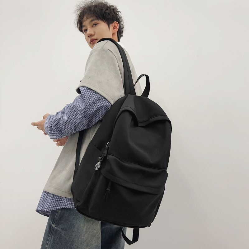 纯色学生书包男超大容量轻便简约百搭双肩包女韩版高中生旅行背包