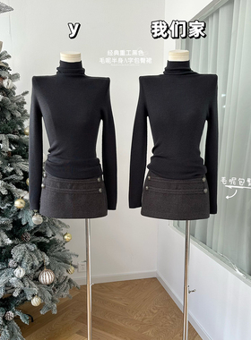 柒月末 经典重工黑色毛呢半身短裙女小众扣眼设计A字包臀裙