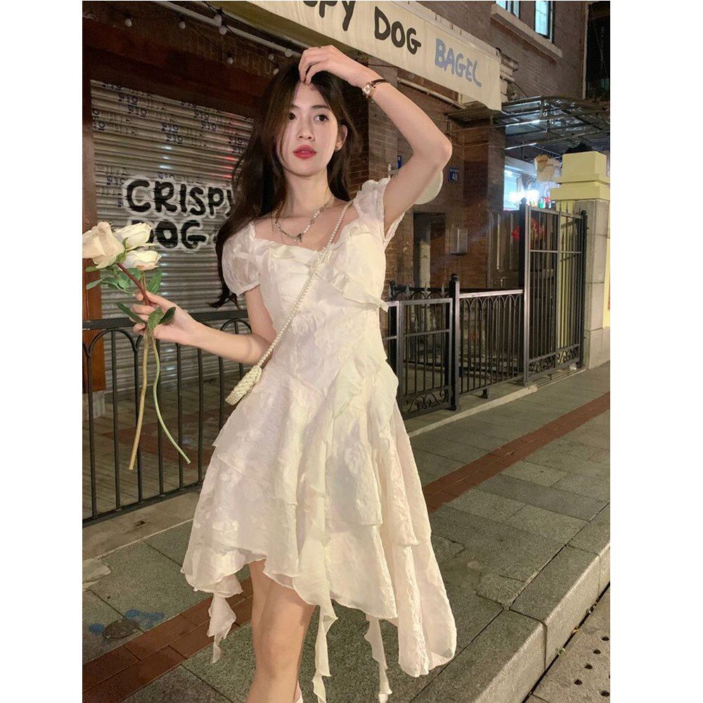 茶歇法式初恋白色不规则连衣裙女春夏季超仙海边度假公主裙小个子