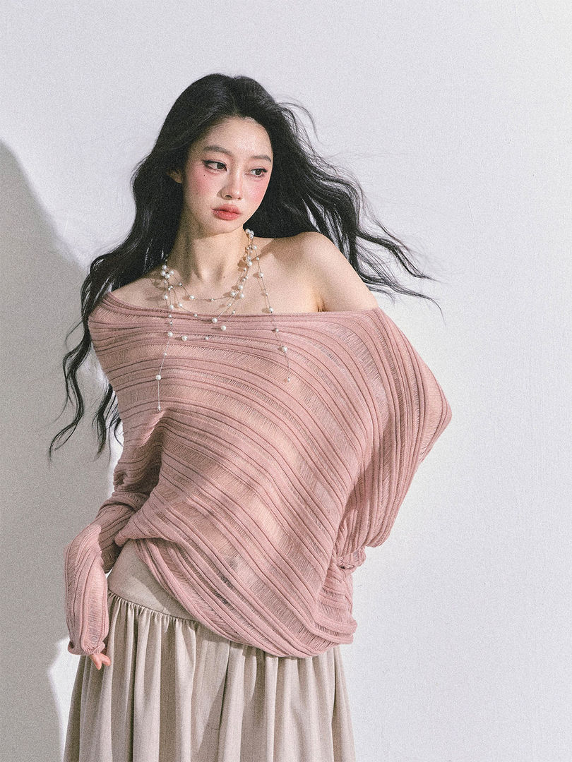 Model wearing a pink off-shoulder ribbed knit top