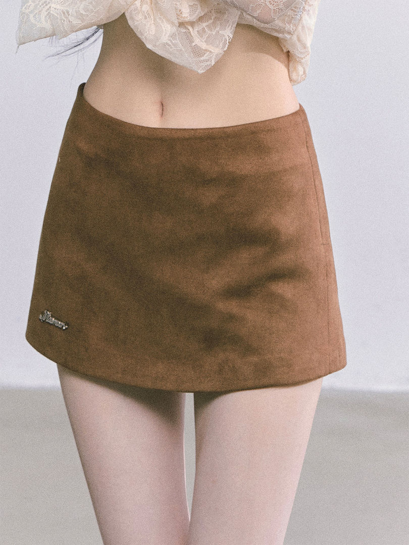 Brown mini skirt worn by a model